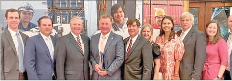 Drew Heaphy (fourth person pictured from left) with Fred Wogan, Mario Nunoz, Todd Fuller, Zeljiko Franks, Dawn Lopez, Meaghan McCormack, David Wilkins, Mary McCarthy, and Blake Hebert after acceptance of his Maritime Person of the Year award from Global Maritime Ministries Inc.