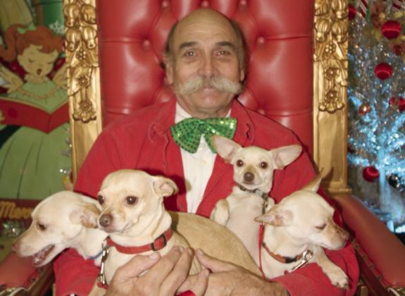 Jimmy Delery and his four-legged friends pose for a Christmas photo.