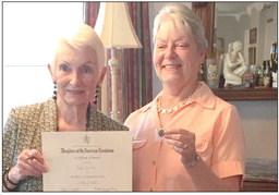 At the annual Francois de Lery Chapter Daughters of the American Revolution tea, the Community Service Award was presented to Gayle Farrell (pictured on the left) for her many hours of volunteering, especially at the St. Bernard Parish Library. Presenting the award is Chapter Treasurer Christyn Elliott.