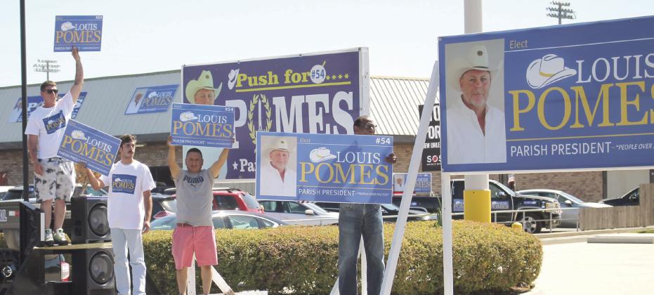Supporters of Louis Pomes wave signs in support of the candidate for St. Bernard Parish President. Photo by Amber Prattini Wallo