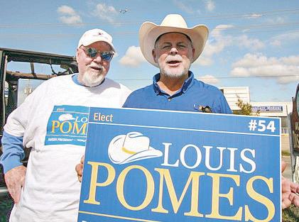 Campaign manager Billy Shultz and candidate Pomes doing midday sign waving. Photos by Jimmy Delery