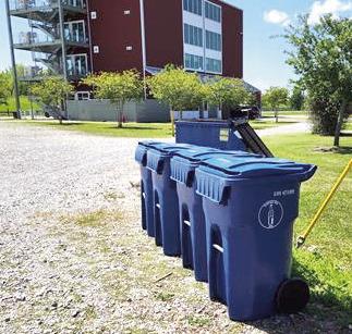 People are encouraged to deposit glass recyclables into the designated blue bins at Docville Farm Mondays through Fridays between 9 a.m. and 4 p.m.