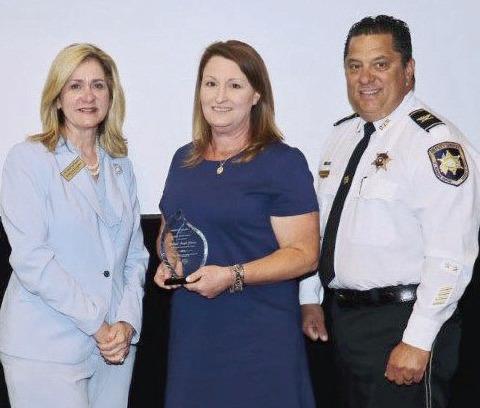 Pictured, from left: Darlene Cusanza (president and chief executive officer of Crimestoppers of Greater New Orleans), Lt. Jennifer Gutierrez, and Col. Chad Clark (commander of the Criminal Investigations Bureau and Lt. Gutierrez’s supervisor).