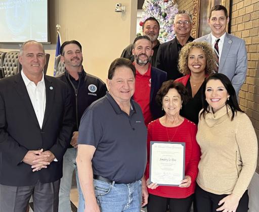 St. Bernard Parish Government Council Members and Parish President Guy McInnis pose for a photo at the Dec.19 Council meeting with the owners of Smitty’s Tire after officially recognizing the company for its 50 years of operations in the parish.