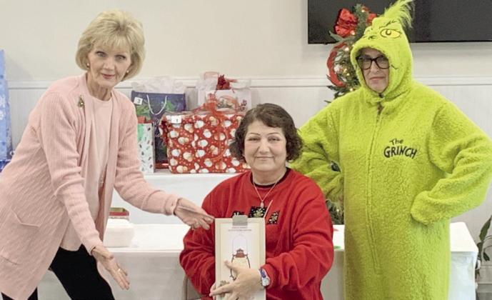 Pictured, from left: Carol Ludwig, Carol Eilers, and Joan Garofalo as the Grinch.