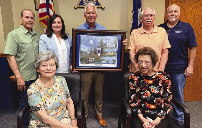 Seated from left: Lena Nunez, Society president, and Janice Crespo-Smith, Society vice president. Standing from left: Joey DiFatta, Society member; St. Bernard Parish Assessor Jaylynn Bergeron Turner, Society member; Sheri James Pohlmann; Bob Smith, Society member; and Jimmy Faust, Society director.