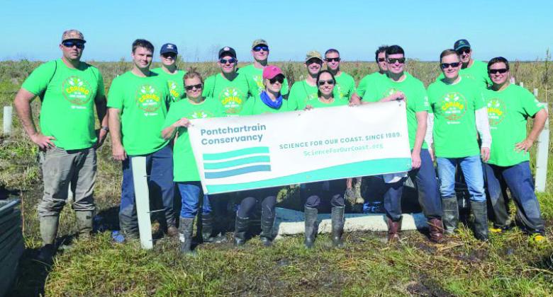 Pictured are the volunteers who planted 500 bald cypress, live oak and water tupelo seedlings in the Bayou Dupre central wetlands area of St. Bernard Parish on Nov. 11. The trees will help enhance the natural coastal wetland buffer, mitigate effects of storm surge.