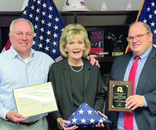 Pictured, from left: US Representative Steve Scalise, Carol Ludwig and St. Bernard Parish Republican Chairman Mike Bayham.
