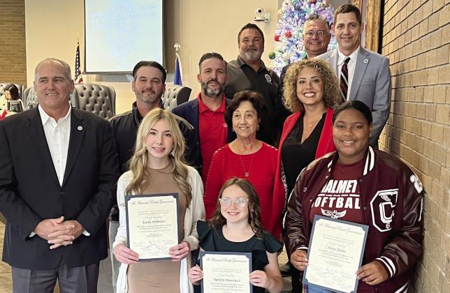 St. Bernard Parish Government Council Members and Parish President Guy McInnis stand alongside St. Bernard Parish's District-wide students of the year at the Dec.19 Council meeting. Raelynn Prestenbach, Kinlee Pohlmann, and Aniya Harris were the respective winners of the elementary, middle, and high school divisions.