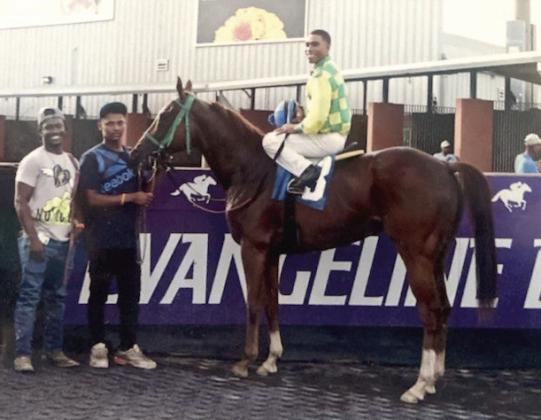Nothing can be more rewarding than the winner circle for Kevin Williams with his racehorse, Permanent Detention.