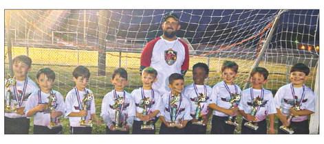Versailles Cardinals were named 5/6-year-old Soccer Undeafted Champions with a 10-0 season record. Pictured, from left: Brady Moss, Zander Caballero, Rhett Sparnecht, Lance Taisant, Trenton Riggio, Martin Mustacchia,Charles Arrington, Hunter Wyatt, Ronnie Hebert and Jake Dysart with Head Coach Matt Taisant.