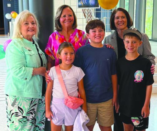 Front row from left: Elle Fleetwood, Jack Dysart, and Quinn St. Amant; Second row from left: Maumus Center Director Carla Carollo, School Board President Diana Dysart, Superintendent Mary Lumetta.
