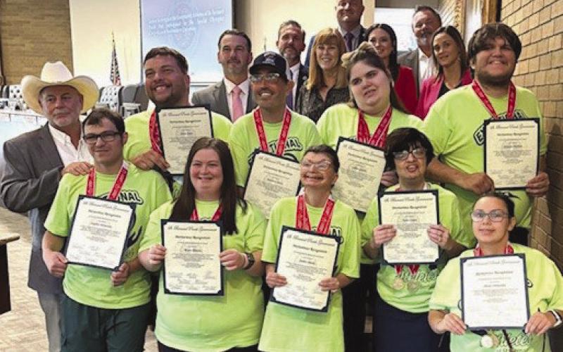 Exceptional Athletes: Parish President Louis Pomes and council members pose for photo with members of the Exceptional Athletes of St. Bernard.