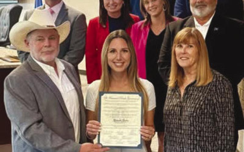 4-H: St. Bernard Parish 4-H Agent Gabrielle Guerra accepts her recognition from Parish President Louis Pomes and council members.