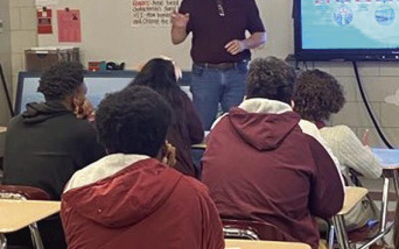 Executive Director Drew M. Heaphy tells Chalmette High students the history of the port.