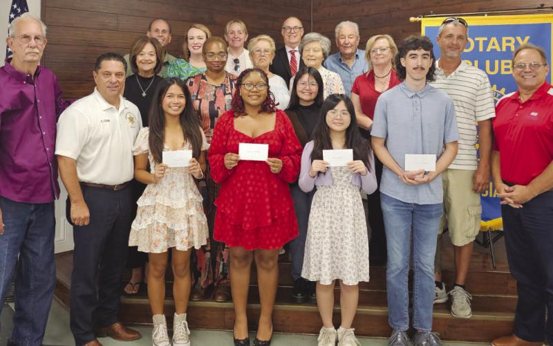 Members of the Rotary Club of St. Bernard pose with this year's scholarship recipients from Chalmette High and their family members during the club's scholarship presentation. Scholarship recipients are Lillian Lai, attending the University of Texas; David England, attending the University of Texas; Celine Bioc, attending the University of Notre Dame; and Destiny Bullock, attending the Massachusetts Institute of Technology.