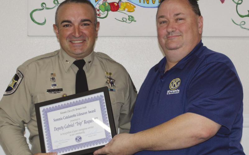 St. Bernard Sheri's Oce Dep. Gabriel "Trip" Roques III receives the prestigious Kiwanis Club of St. Bernard Sammie Catalanotto LifeSaver Award from Kiwanian Ellis Fortinberry.