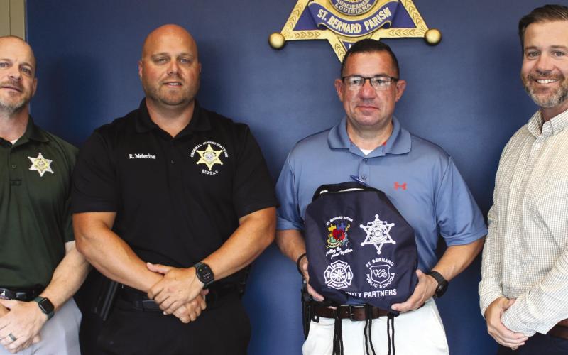 St. Bernard Sheri's Oce Sgt. Jerey Vega, third from left, and Assistant District Attorney Daniel Dysart, far right, both board members of the St. Bernard Autism Awareness Krewe, recently presented sensory bags to SBSO Criminal Investigations Bureau detectives, from left: Lt. Daniel Carreras and Capt. Ryan Melerine.