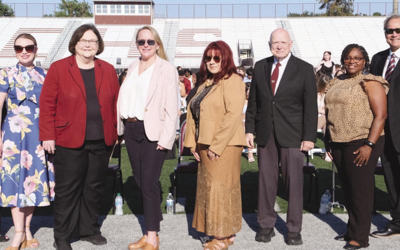 Left to Right Principal Will Schneider, Assistant Principal Cookie Mundt, School Board President Katherine Lemoine, Superintendent Doris Voitier, School Board Members Carly Creason, Rosiland White, Principal Wayne Warner, School Board Members Keisa Rodney, Sean Warner, Henry Rodriguez III.