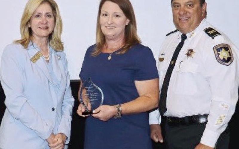 Pictured, from left: Darlene Cusanza (president and chief executive officer of Crimestoppers of Greater New Orleans), Lt. Jennifer Gutierrez, and Col. Chad Clark (commander of the Criminal Investigations Bureau and Lt. Gutierrez’s supervisor).