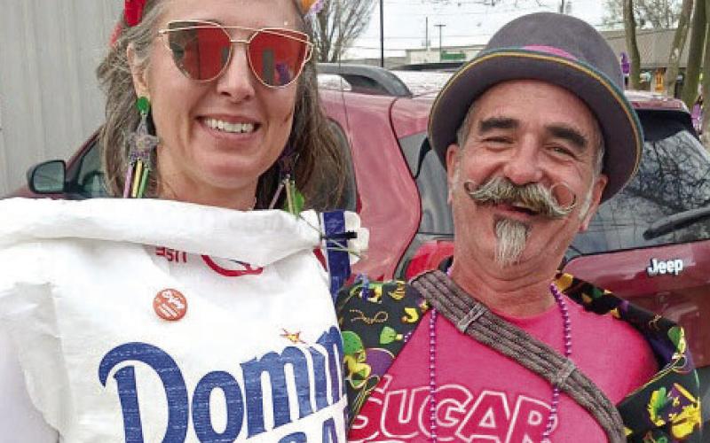 Sabrina and Eric Schmidt at the Old Arabi Lundy Gras Walking Parade.