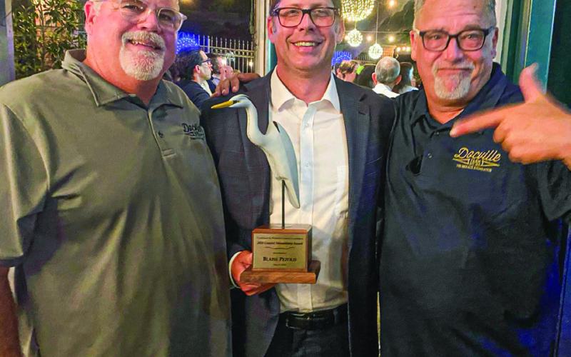 Bill Haines, Blaise Pezold and Chris Haines at the Coalition to Restore Coastal Louisiana award ceremony.