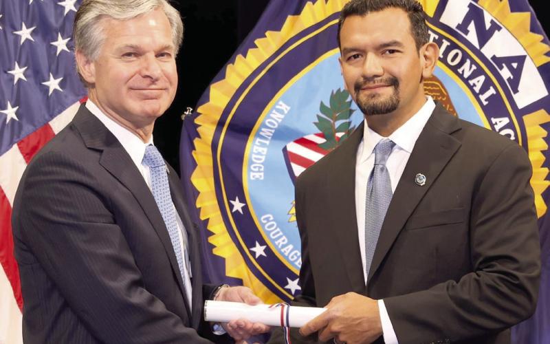 SBSO Lt. Jorge Vargas, right, receives his diploma from FBI Director Christopher Wray upon graduating from the FBI National Academy.