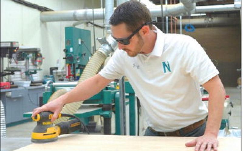 The SkillShop at Nunez will be available to participants in Nunez Community College’s Marine Debris Removal Challenge design contest this spring and summer. Teams of two will receive a supply budget and access to tools to build a prototype. Pictured, Construction Technology Program Chair Adam Bourne uses a sander in the SkillShop.
