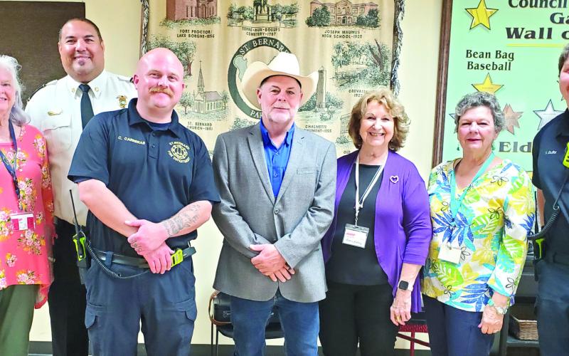 Pictured, from left: Terry Heidel, Chief Earl Borden Jr., Capt. Carreras, Louis Pomes, Leona Galley, Glenda Fedele and Fireman Quirk.