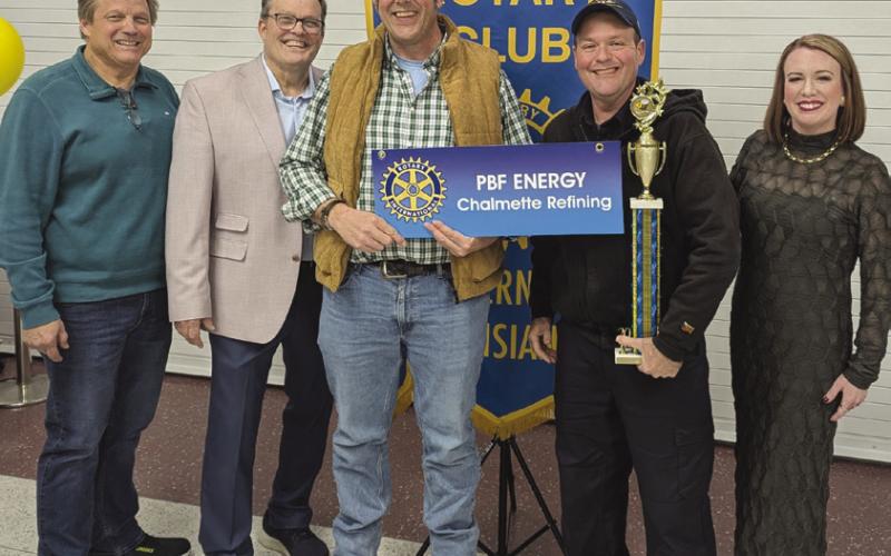 The two-time winners of The Rotary Club of St. Bernard Corporate Spelling Bee. Chris Zinskie and Scott Richard, representing Chalmette Refining / PBF Energy, Also pictured are Sean Warner and Dr. Katherine Lemoine, Rotary Club members, and Barry Lemoine, the emcee of the Spelling Bee.