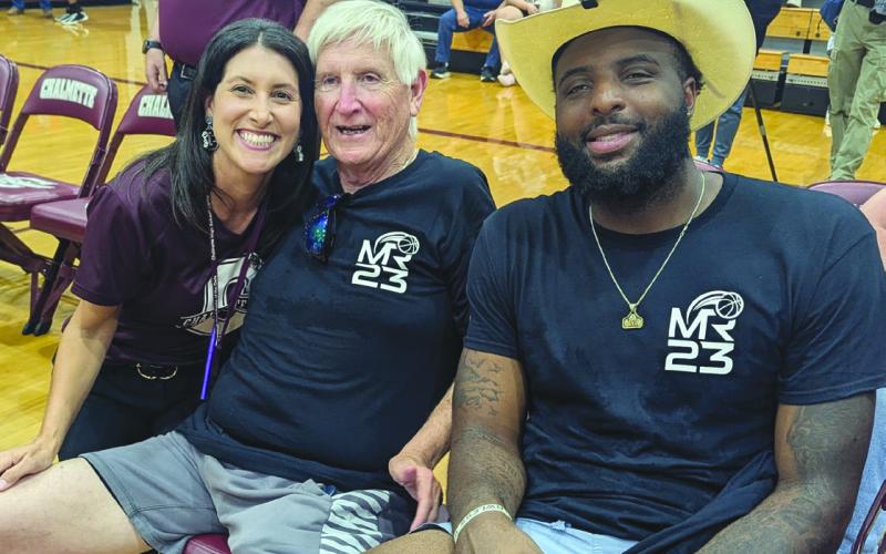 CHS Assistant Principal Kelli Watson with Coach Butch Stockton and Knicks player Mitchell Robinson.