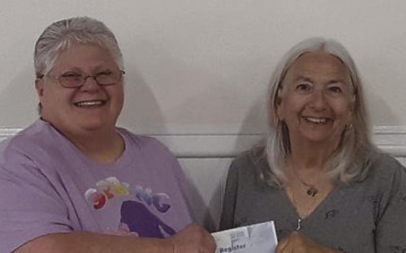 NARFE Vernon N. Landry St. Bernard Chapter 1398 Treasurer Sylvia Keller is pictured here (on the right) presenting Laura Napolitano, Chapter Alzheimer’s Coordinator, with a check for $2,000 in contribution to the NARFE Alzheimer’s Fund. Since 1985, NARFE has supported research into the cause, prevention, and treatment ofAlzheimer’s disease, and has donated more than $15,000,000, thus far.