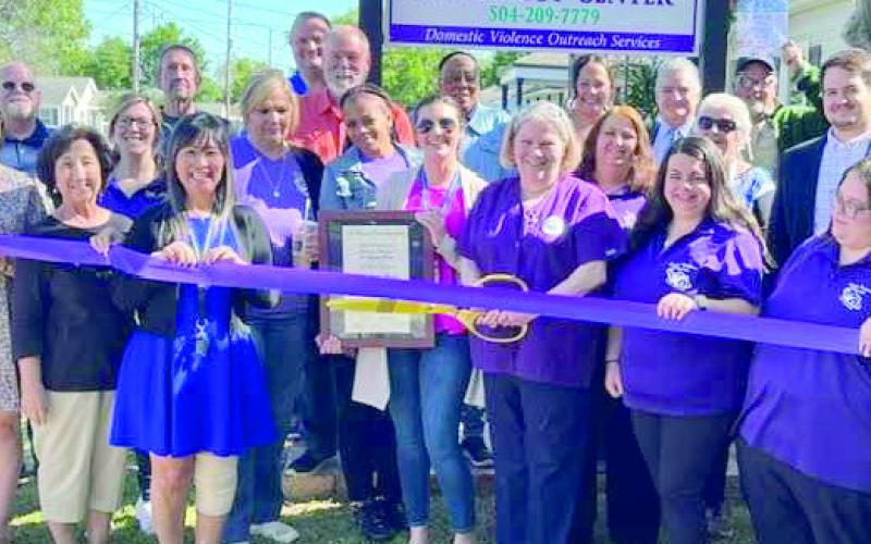 Local officials and members of the community pose for a photo at the the ribbon cutting of the Thelma Deano Advocacy Center in Chalmette.