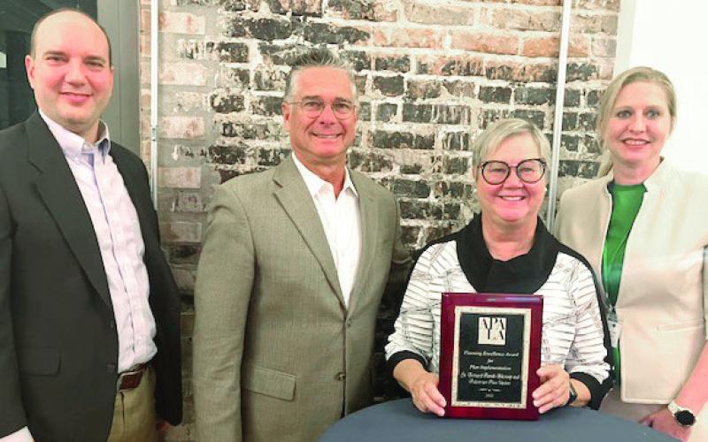 Pictured, from left: Richard Poche (St. Bernard GIS Consultant), Howard Luna (Parish Councilman and member of the Parish Bikeway and Pedestrian Advisory Committee), Deborah Jan Fagan (Bikeway Planning Consultant) and Whitney Hoffman Sayal (President of the Louisiana Chapter of the American Planning Association.)