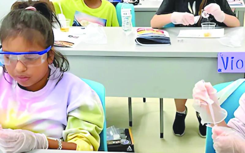 The STEAM Department at Nunez Community College will o er more than 10 multi-day camps for young students this summer. Pictured, students conduct an experiment in a past Astro Camp at Nunez.