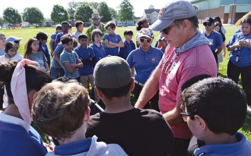 Blaise Pezold reviewing the planting map with students before teams headed out to each site.