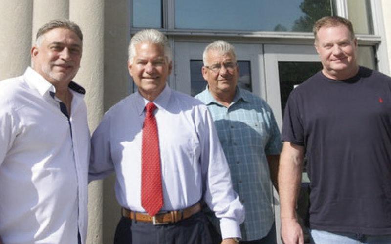 Sheriff Pohlmann with some of his team on the Courthouse steps with a victory of no opposition in hand. Pictured, from left: John Doran, Sheriff Pohlmann, Robert Broadhead and John Kickers.