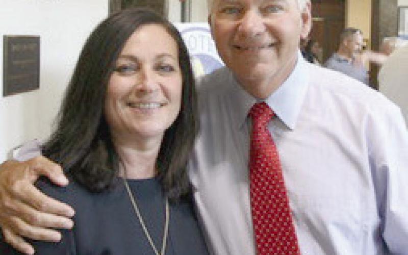 Assessor Jaylynn Turner and Sheriff James “Jimmy” Pohlmann have a victory hug with no opposition.