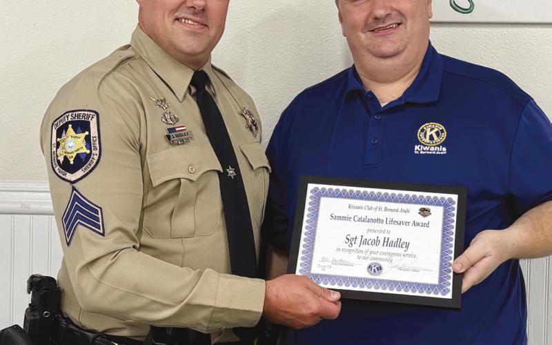 St. Bernard Parish Sheri 's O ce Sgt. Jacob Hadley, left, is presented with the Kiwanis Club of St. Bernard Sammie Catalanotto LifeSaver Award by Kiwanian Ellis Fortinberry.