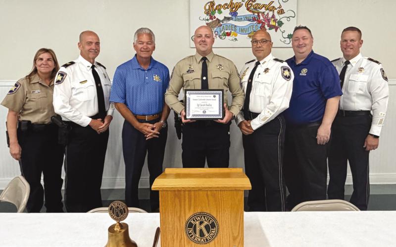 Sgt. Jacob Hadley, center, poses with his Kiwanis Club of St. Bernard Sammie Catalanotto LifeSaver Award. With Sgt. Hadley are from left: Sgt. Darlene Langsford, Col. Kevin Sensebe, Sheri James Pohlmann, Capt. Stephen Ingargiola, Kiwanian Ellis Fortinberry and Col. Daniel Bostic Jr.