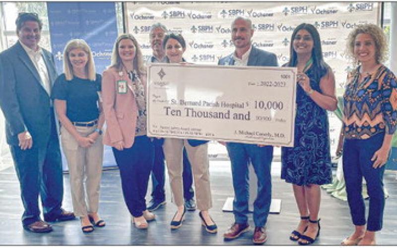 SBPH officials and council member at-large east Kerri Callais (far right) accept $10,000 grant from LAMMICO.
