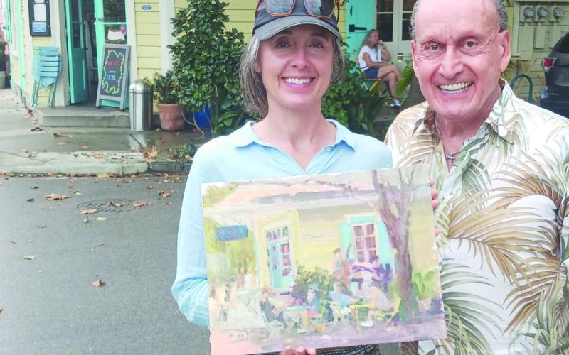 A recent special outdoor market invited Sabrina Schmidt of Chalmette to paint at the corner of Royal and Clouet St. She was visited by art collector Sidney Torres from Poydras.
