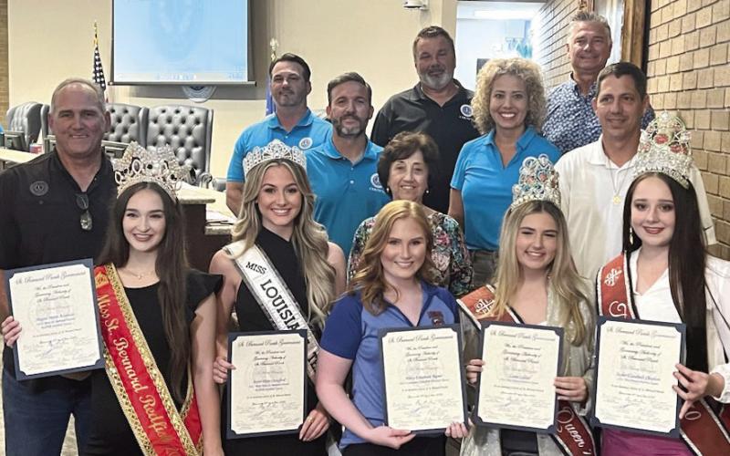 St. Bernard Parish festival queens pose with council members and parish president Guy McInnis as they accept their 'honorary citizen' proclamations.