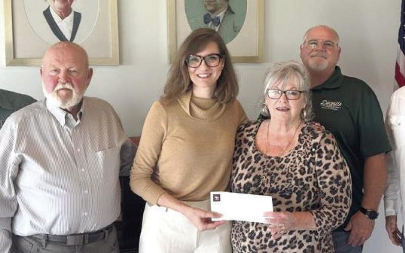 Meraux Foundation board members present donation to Joy Bruce, the executive director of CASA. From left to right: Meraux Fdn. Board of Directors Chris Haines, Floyd Gue, Joy Bruce, CASA Executive Director; Rita Gue, Bill Haines and Sidney Torres III.