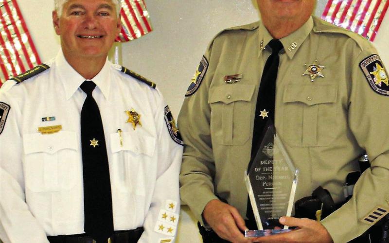 Dep. Mitchell Perkins (right) poses for a photo with St. Bernard Parish Sheriff Jimmy Pohlmann.