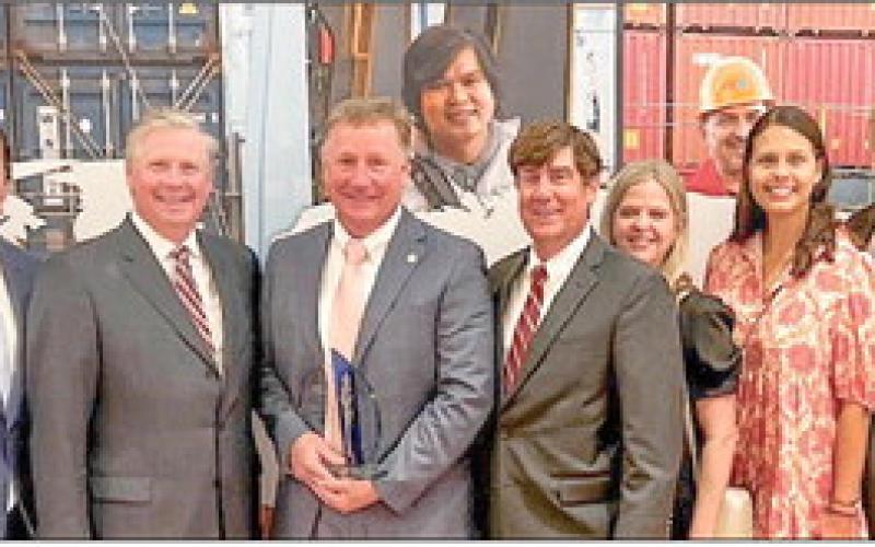 Drew Heaphy (fourth person pictured from left) with Fred Wogan, Mario Nunoz, Todd Fuller, Zeljiko Franks, Dawn Lopez, Meaghan McCormack, David Wilkins, Mary McCarthy, and Blake Hebert after acceptance of his Maritime Person of the Year award from Global Maritime Ministries Inc.