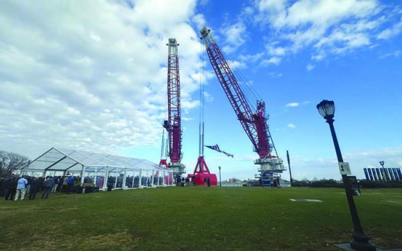 Associated Terminals’ “D. Lopez” and “Bill S.” cranes, newly christened January 22 at Woldenberg Park in New Orleans.