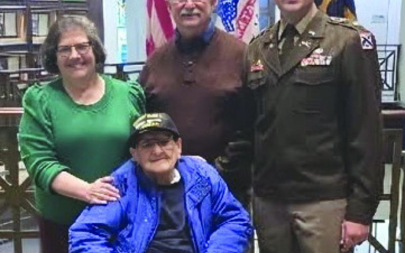 Seated WWII Veteran Eddie Tresch, Donna Tresch, Eddie Tresch Jr, and son Lt. Colonel Andrew Tresch. Three generations of the Tresch attended the promotion of Andrew Tresch to Lt, Colonel at Fort Leavenworth Kansas.