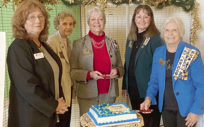 Past Regents (pictured, from left) Mary Ellen Menge, Fay Champagne and Christyn Elliott, along with Regent Gayle Buckley, recently gathered with organizing Regent Bonnie Cook to cut Francois deLery Chapter's 54th Anniversary cake. The Daughters of the American Revolution Chapter was formed 54 years ago in St. Bernard Parish. The ceremony took place in the lobby of Chalmette High School's Cultural Arts Center.