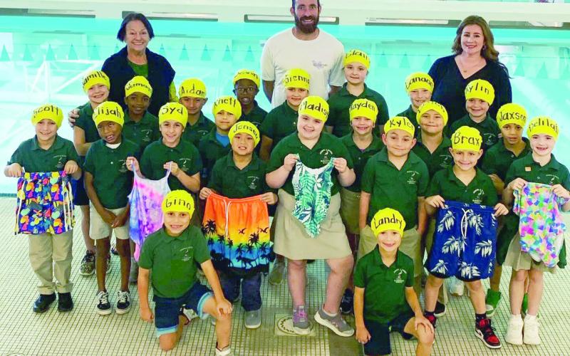 Giving back to the community is one of the pillars of the St. Bernard Sports Hall of Fame. This fall, the St. Bernard Sports Hall of Fame donated $500 worth of swimsuits, caps, and goggles to the elementary swim program in St. Bernard Parish. This program is taught by Coach Millie Soroe. It is a wonderful program that teaches our youth the importance of swim safety and how to swim. Vice President of our Board of Directors and PE teacher, Shane Quirk delivered the items to Coach Soroe.